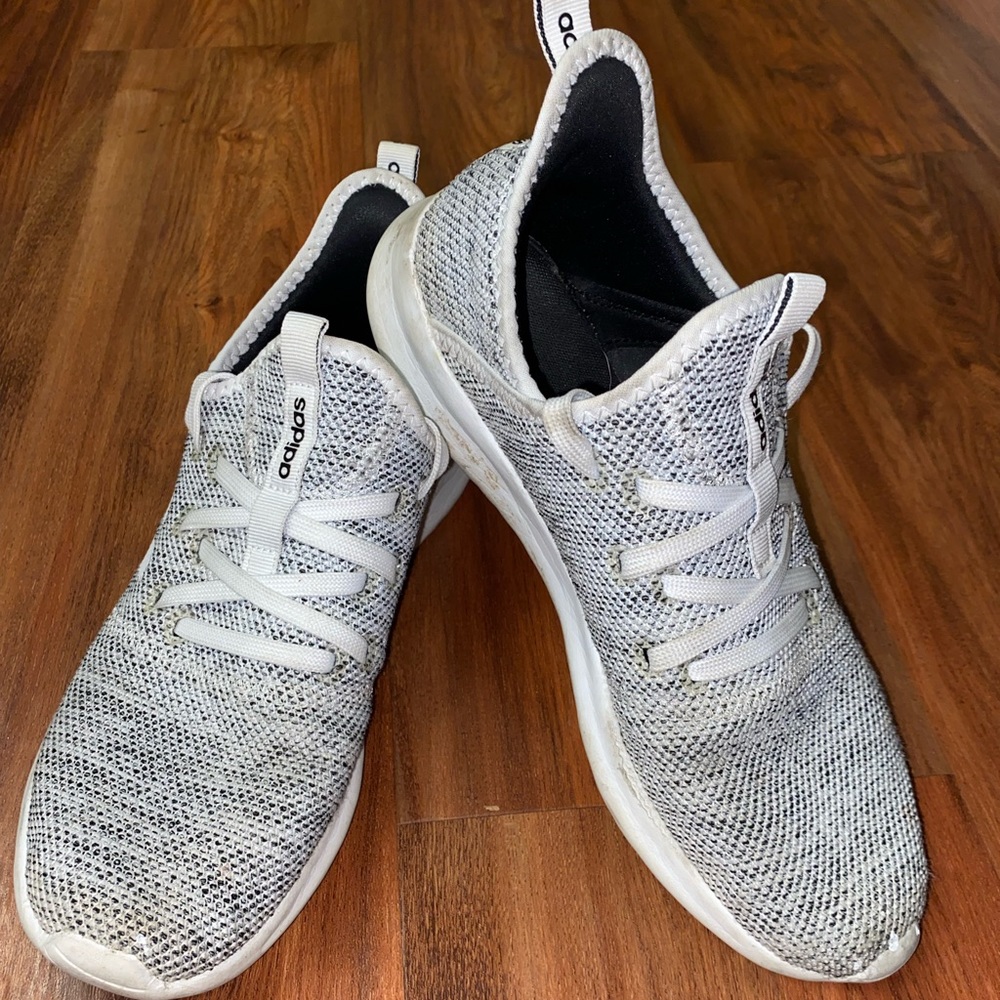 White and black women’s Adidas tennis shoes size 9.5
